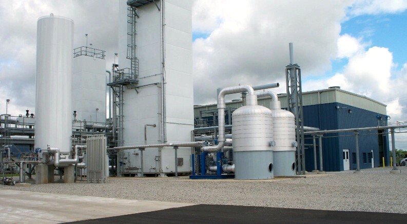 Molecular sieve unit and cold boxes near compressor building in New Carlisle, Indiana air separation plant designed and supplied by UIG for Airgas. Carrollton Kentucky air separation plant is similar.